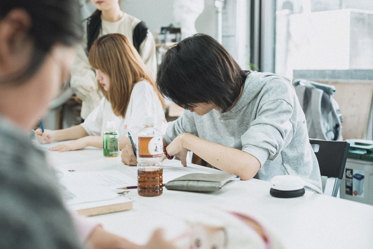 A calm desk with a notebook and pen for studying Japanese